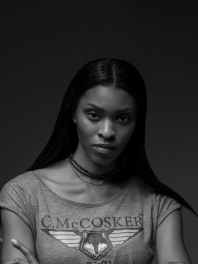 Grey C.McCosker graphic tee with a wolf-and-wings emblem, shot in black and white